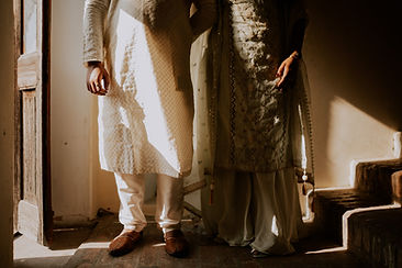 Dhritya and Mehul’s romantic pre-wedding shoot at Laal Haveli, featuring a vintage railway station vibe with the couple in el