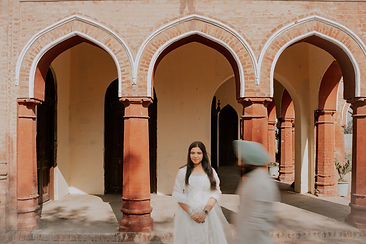 Dhritya and Mehul’s romantic pre-wedding shoot at Laal Haveli, featuring a vintage railway station vibe with the couple in el
