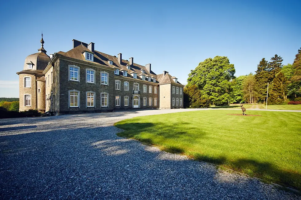 The Bois Saint Jean estate under a clear blue sky.