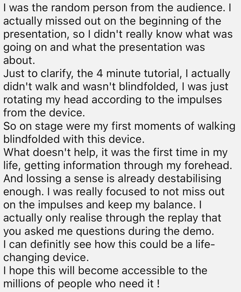 Text block describing a person’s experience on stage using a device to walk blindfolded, highlighting their surprise and focus during a demo.