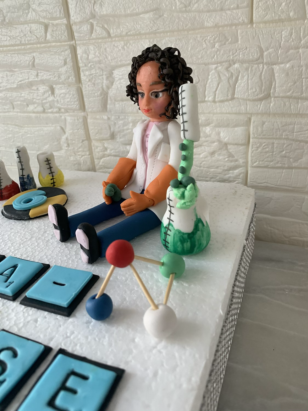 Thumbnail: Edible Chemist/Scientist Cake Topper