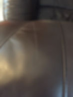 BEFORE: scratched leather couch