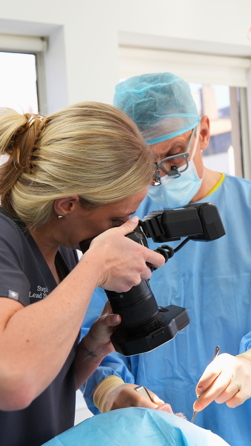 Professional videographer operating a camera during a commercial video shoot.