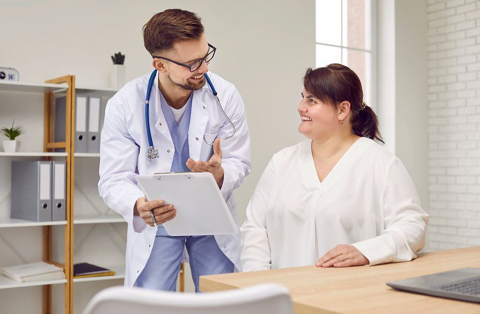 Overweight woman having consultation at doctor's office Portrait of smiling doctor holding