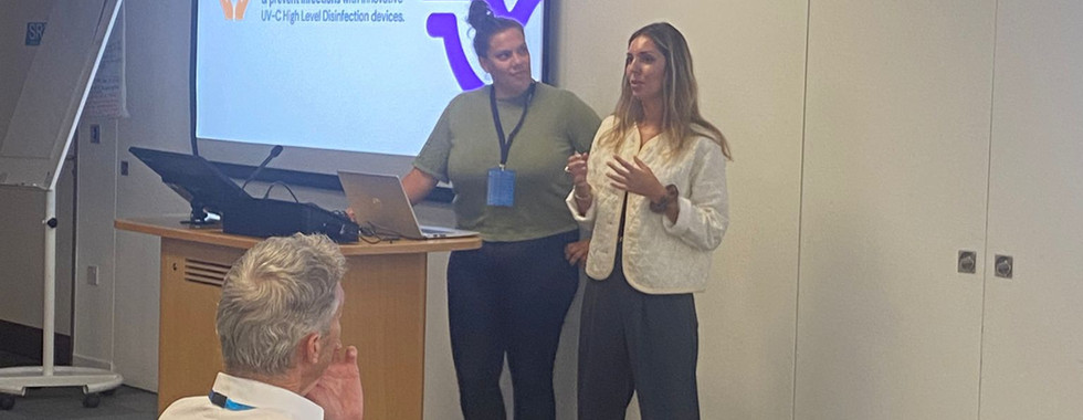 Fanny Pulon, R&D Director at Germitec, presenting the Chronos Max UV-C High-Level Disinfection system at a medical conference. The Chronos Max is designed for rapid, chemical-free disinfection of Transesophageal Echocardiography (TEE) probes and ENT endoscopes without operating channels.