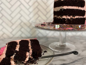 chocolate raspberry cake with mini chocolate chips and raspberry meringue buttercream