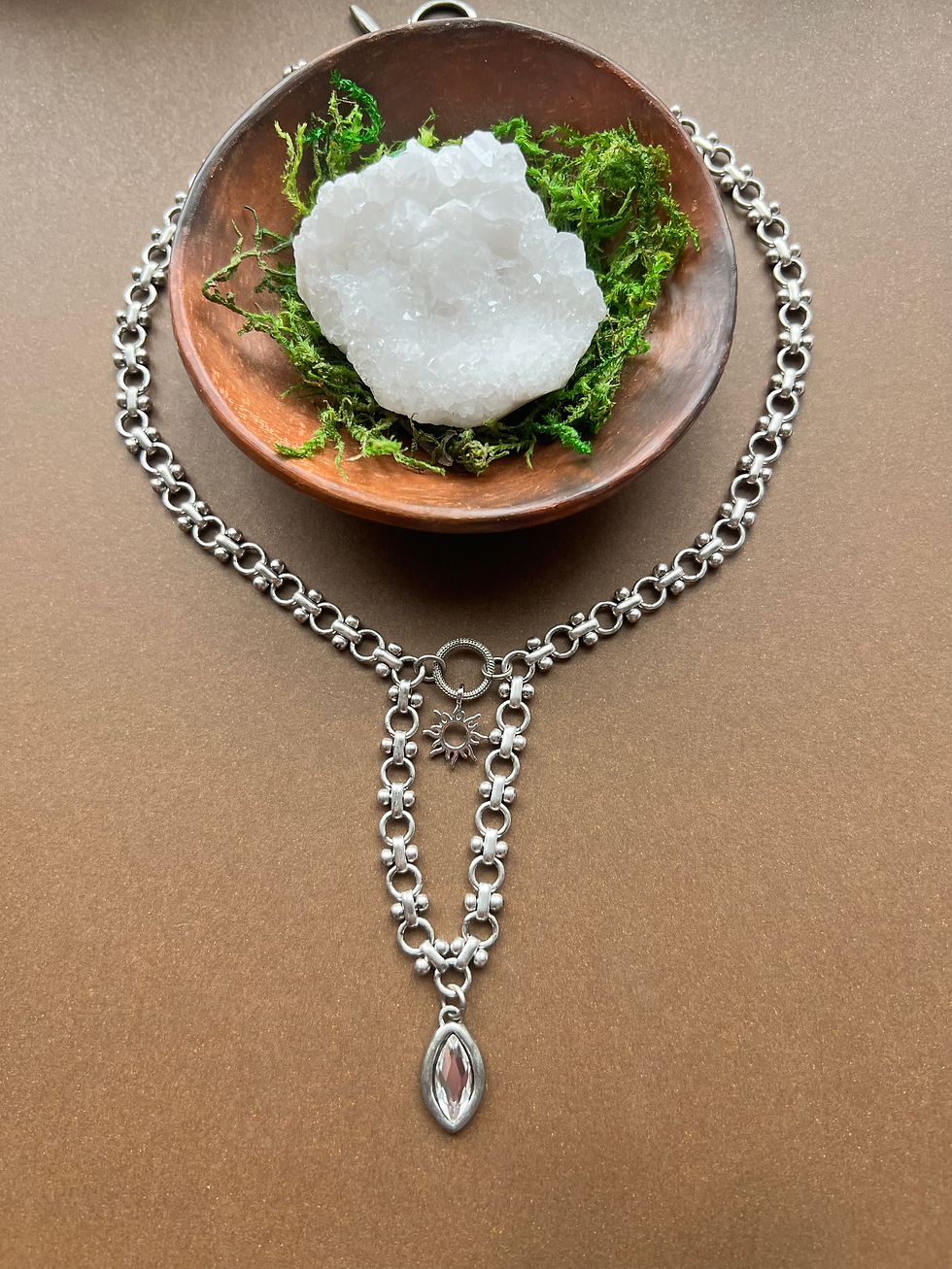 Thumbnail: silver tone drop style necklace with sun and rhinestone charm accents