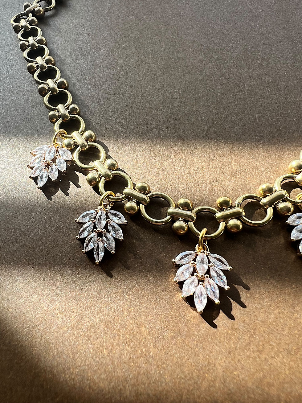 Thumbnail: cz charms on a brass chain