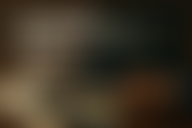 Photorealistic image of a desk with a laptop showing a user network diagram, a hand pointing to a tablet with a pie chart, and an AI chip on a graph. Text reads: “AI-POWERED PERSONALIZATION AT SCALE – THE B2B MARKETING ADVANTAGE.”