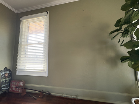 A bedroom that has been re-painted.