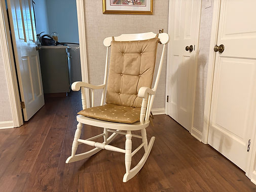 Rocking chair after being painted antique white.