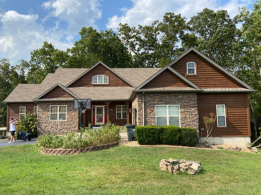 Exterior of home after having wood stained brown.