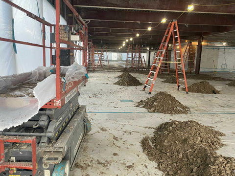 Mid-phase photo of asbestos removal from ceiling demonstrates order and cleanliness of site throughout the abatement process
