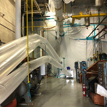 Negative air machines use ducting to remove contaminated air from a sealed containment area