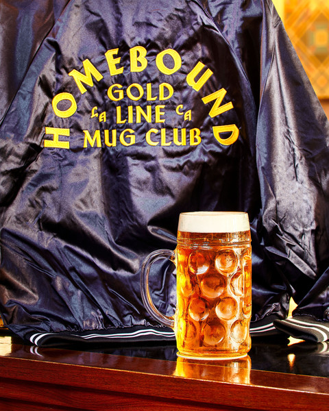Homebound Gold Line Mug Club Jacket with stein of beer
