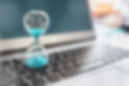 Hourglass on laptop