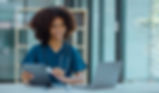 Woman smiling while accessing computer