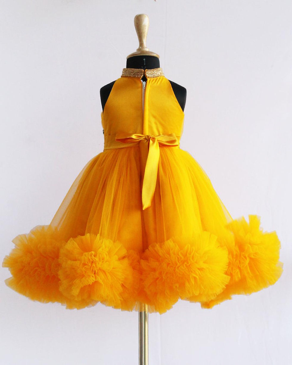 थंबनेल: Yellow Ruffle Frock With Gold Kardana on Top