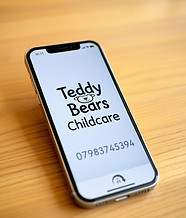 phone sitting on a table top with the words Teddy Bears Childcare on it followed by the nu