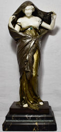 A French Gilt free standing bronze patina sculpture shows a female figure as nature who unveils her white marble figure before science.  