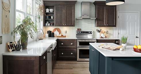 Modern transitional kitchen with dark wood perimeter cabinets and a contrasting navy blue island.