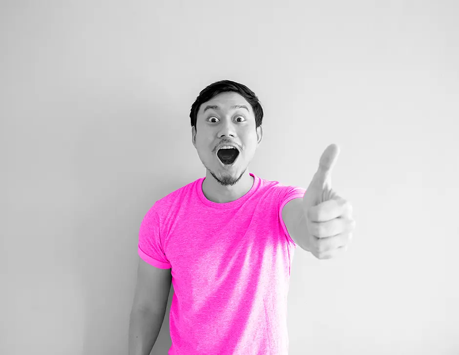 Man in vibrant pink t-shirt with his thumbs up