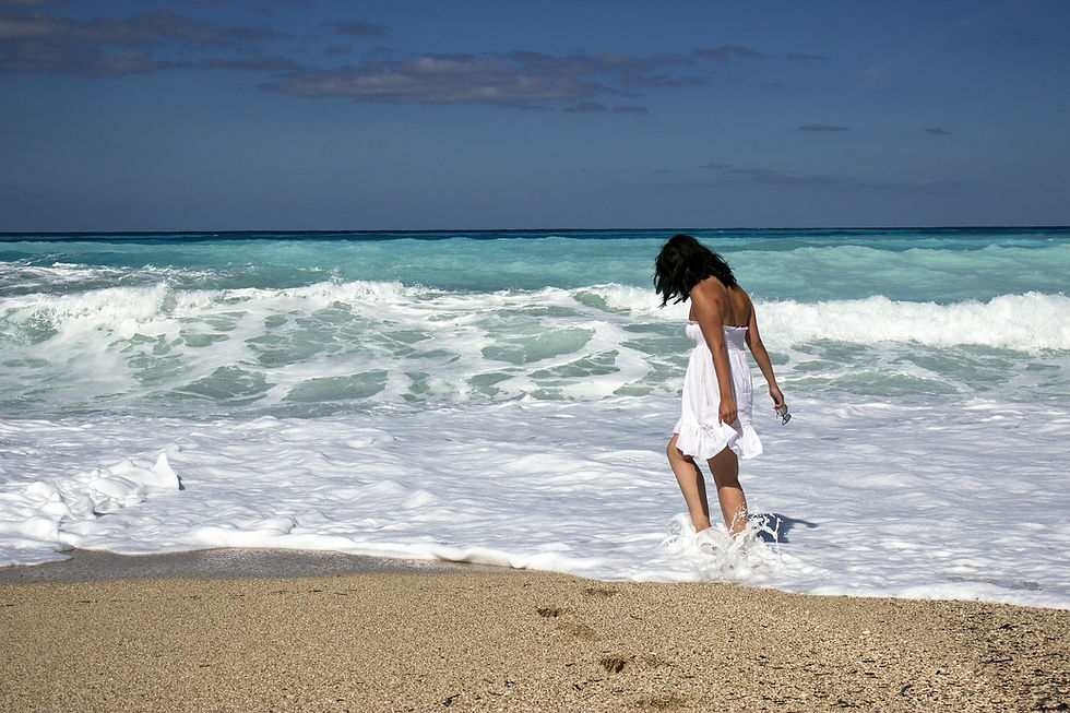 Woman walking on the beach.