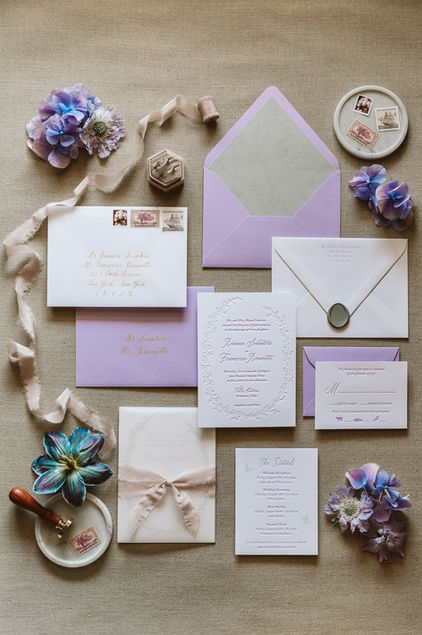 full wedding invitation suite and flatlay in shades of purple and cream