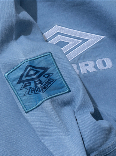 ② L UMBRO Iconic Drill Top liam Umbro Iconic Drill Top | Oasis