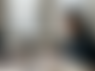 Line producer working at cluttered office table