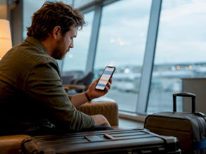 Production coordinator reviewing travel insurance quote