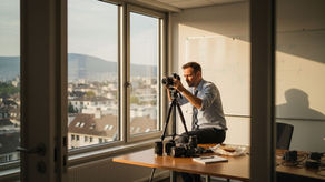 Swiss video producer setting up camera in office