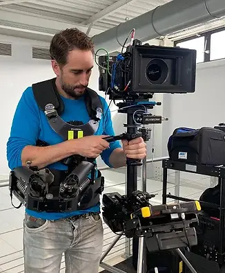 Pieter Nijssen Tulip Films holding a camera on a film set