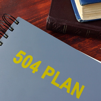 Book with title 504 plan. Special education concept..jpg