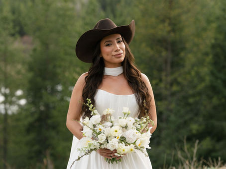 Bride wearing a Hannah Jane Couture Dress with a beautiful Montana background