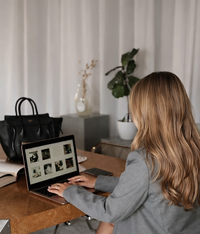 Focused woman at modern desk.png