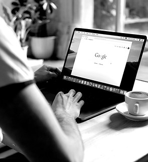 Man uses Apple MacBook in a cafe or rest