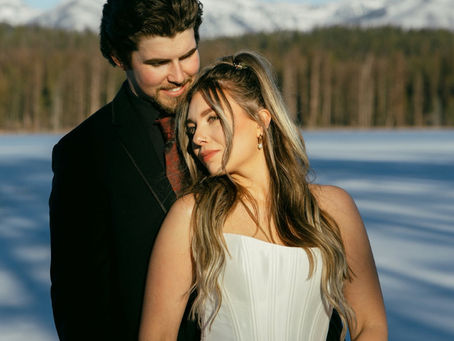 Bride and groom on a frozen lake