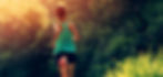 SOBER HOUSE woman running along a wooded tail in the morning light for recovery and a WELL
