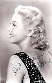 Evelyn signed photo looking over left shoulder