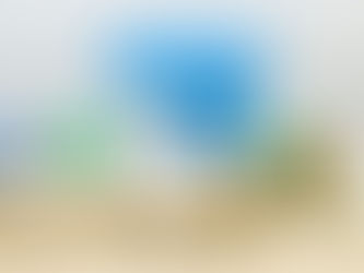 Toy house with blue roof, coins stacked on dollar bills, keys, and a book. Scene suggests real estate investment or savings.