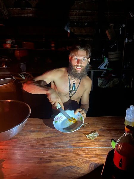 Finn preparing dinner in the maloca