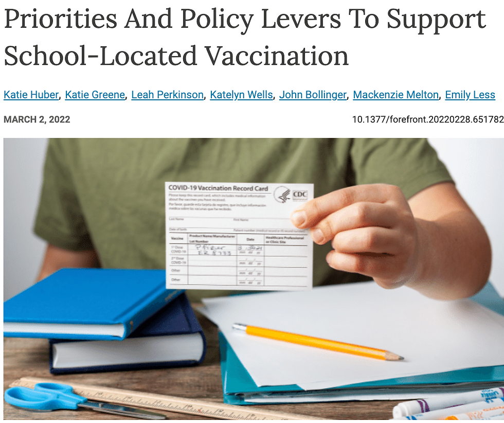 journal article with adult holding Covid vaccination card