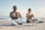 shot-of-two-young-women-meditating-during-their-yo-2022-09-30-21-02-11-utc.jpg