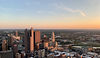 Aerial view of Columbus, Ohio skyline at sunset with buildings and sky.