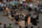 A crowd gathered around a band