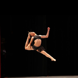 Young dancer in black from Power Music & Dance performing award winning number