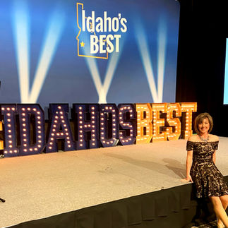Lori Power, owner of Power Music & Dance, sitting on stage at Idaho's Best Awards
