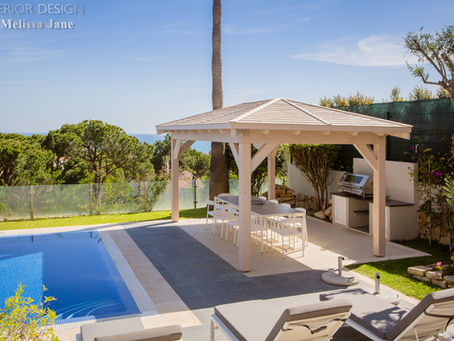 Outdoor dining area next to swimming pool