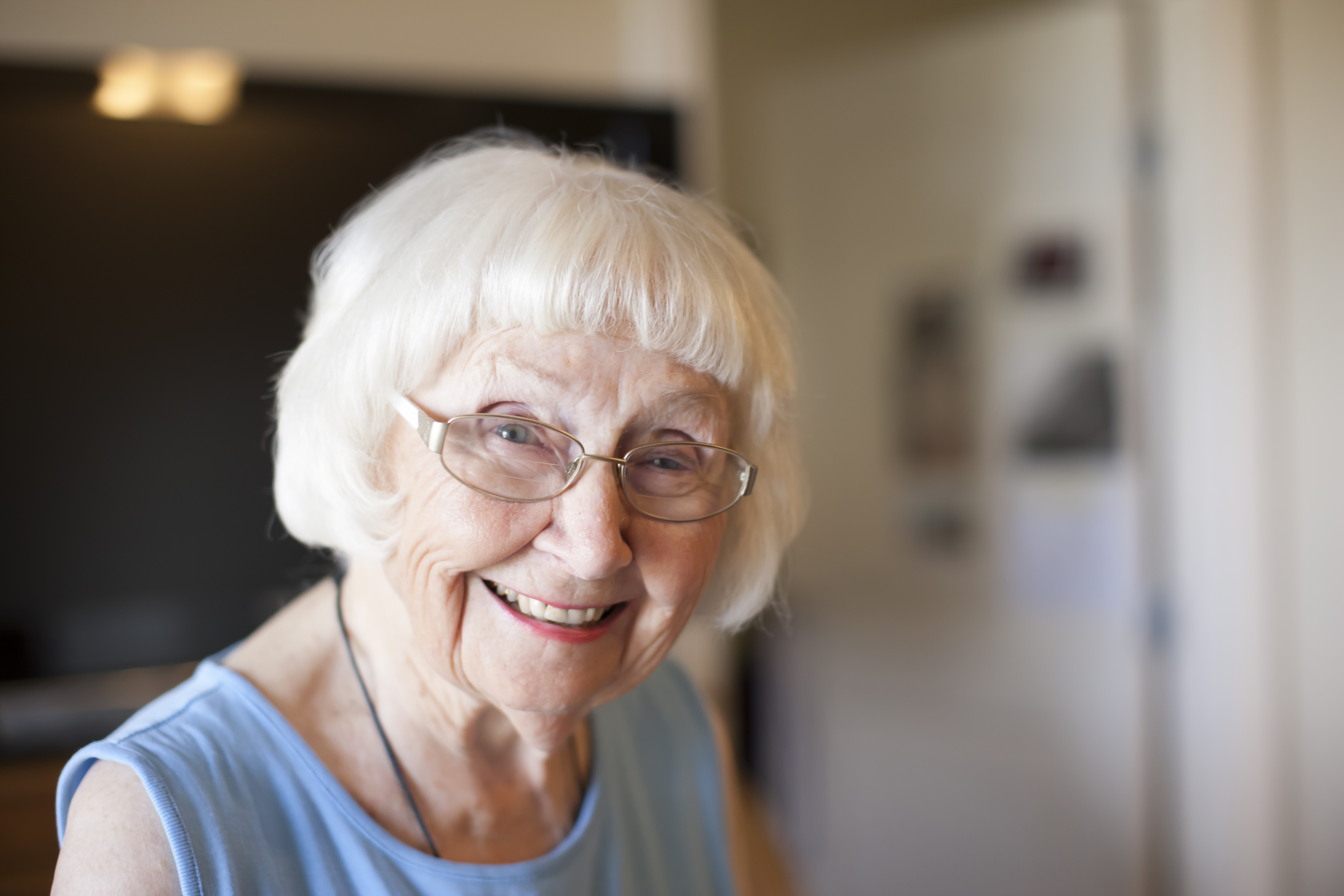 portrait-of-senior-woman-indoors-smiling-2024-10-21-13-18-55-utc.jpg